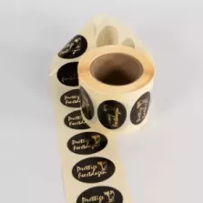 Autocollant joyeuses fetes 25x36mm ovale noir et or